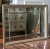 A classically styled, high quality mirror with nine individually beveled panels and a soft gold gilt wood frame. It is...