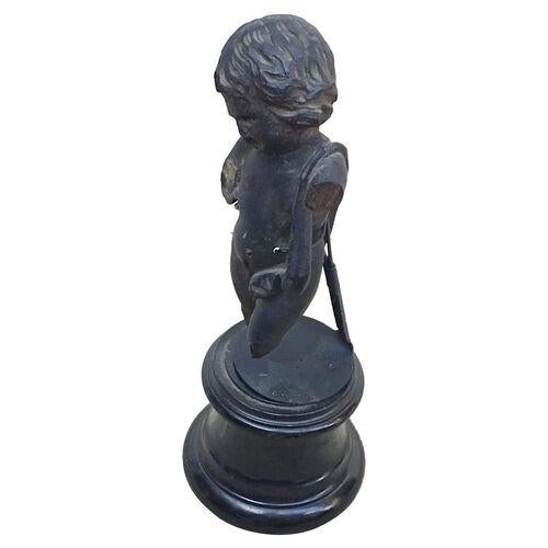 Antique 19th century French hand carved wood cherub sculpture on a polished and ebonized and turned shaped base. No...