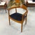 A sculptural mid-century armchair closely following Hans Wegner's celebrated 1949 Round Chair design. The curved crest...