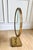 A striking vintage brass tabletop mirror from Italy with an intricate pierced star-pattern border and beautifully sculpted...