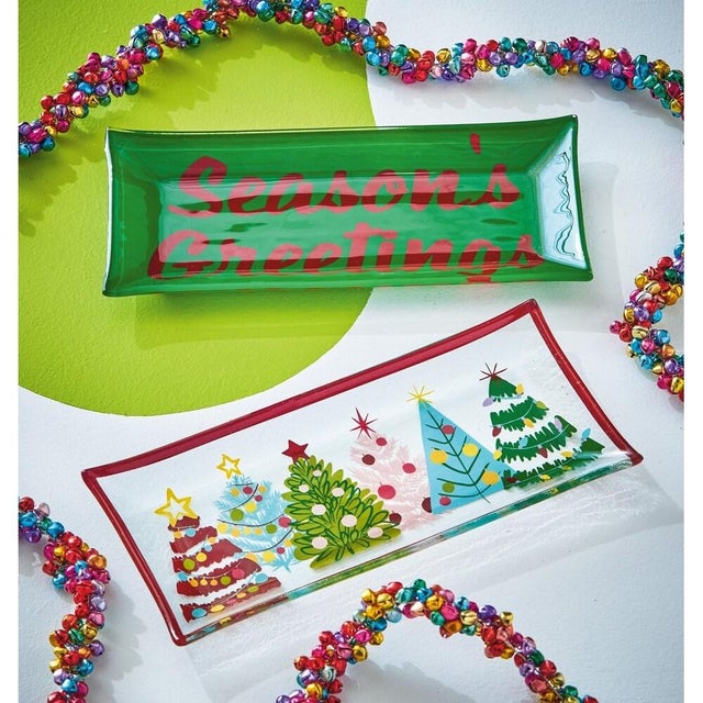 Add a touch of playful nostalgia to your holiday decor with the Groovy Trees Glass Trinket Tray. Featuring colorful retro...