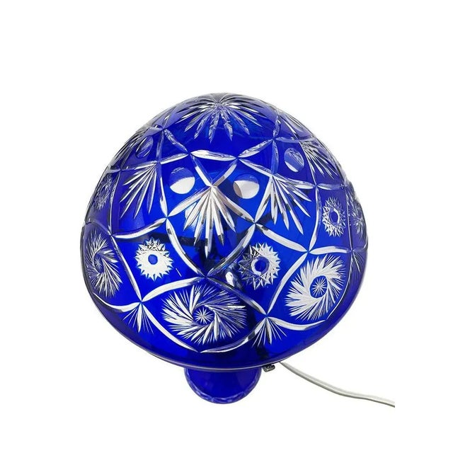 A Bohemian blue cut to clear crystal mushroom lamp, 1980s A mushroom lamp of 60 cm high made of Blue cut to clear crystal....