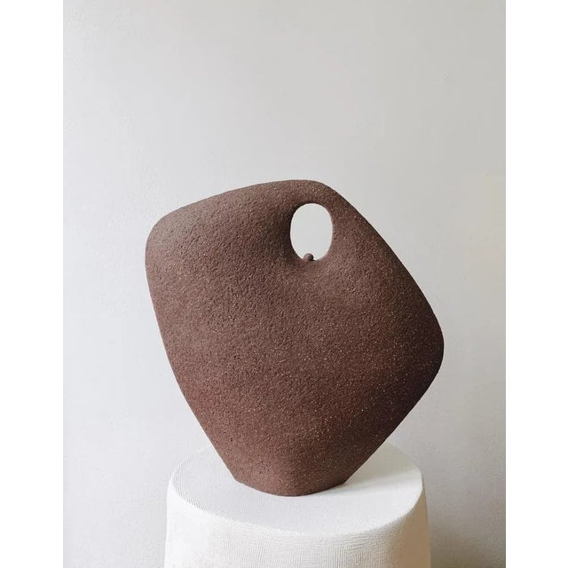 Gaïa Tribu 14.23 Sculpture by Léontine Furcy unique piece. Materials: Rough chamotte red sandstone. Dimensions: L 28 x H...