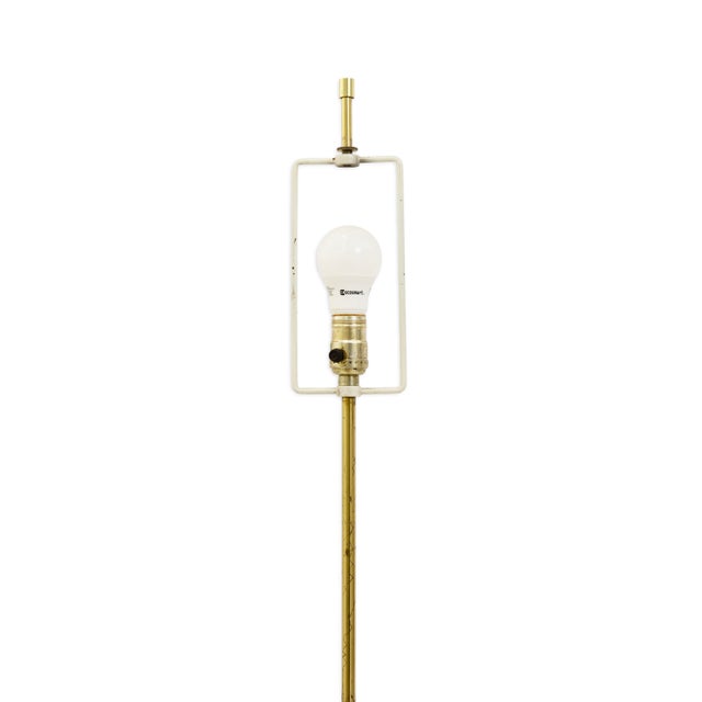 This vintage floor lamp by the Laurel Lamp Company features a sleek, modernist profile crafted in polished brass. The...