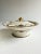 Fine porcelain covered dish with beautiful gold and floral details.