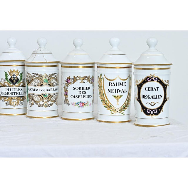 A set of vintage French Limoges porcelain apothecary jars, each of the fifteen gorgeous jars (all uniform in size) labeled...