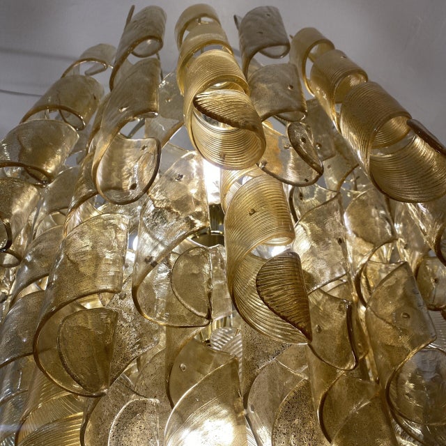 A unique and technically complex piece, composed of countless individual fusilli-shaped or stylized spirals that combine...