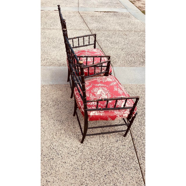 Very pristine English Faux bamboo chairs with French style fabric.
