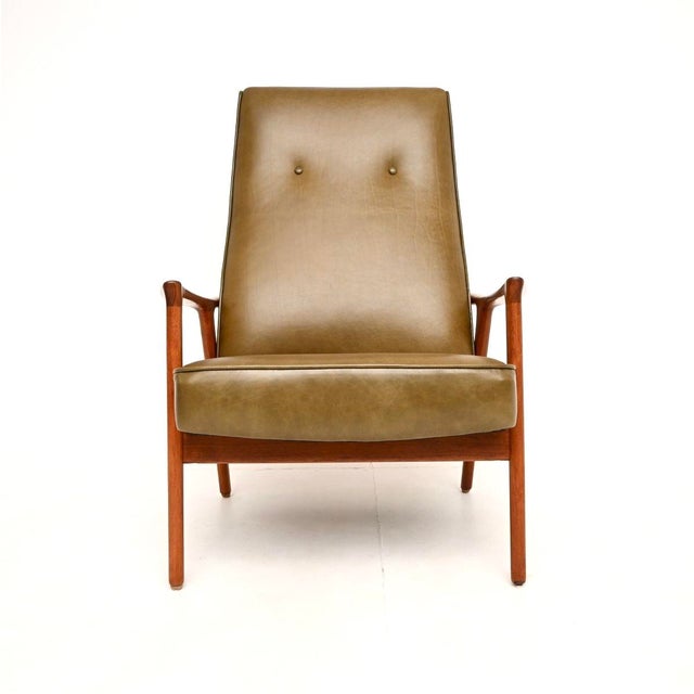 An absolutely stunning and very rare vintage Swedish armchair in walnut and leather by Inge Andersson. The model is called...