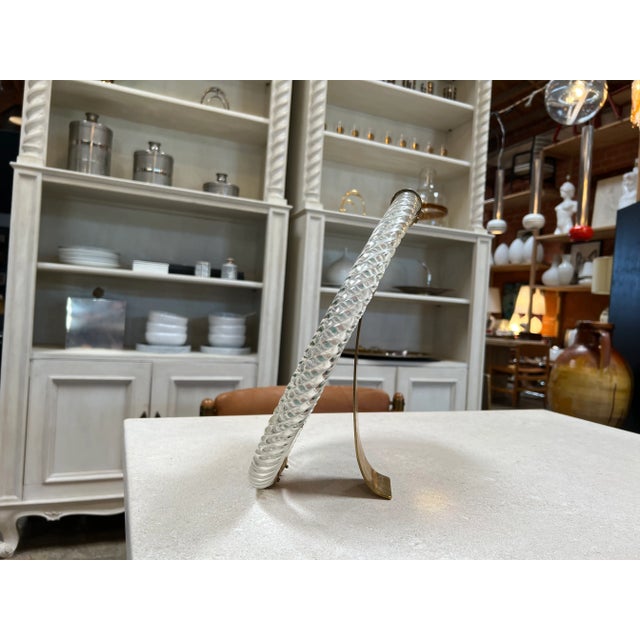 The Vintage Italian Murano Round Table Mirror from the 1960s is a captivating and reflective piece that embodies the...