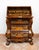 Antique Dutch chest of drawers made of fine exotic woods, dating back to the early 19th century. The front features a...
