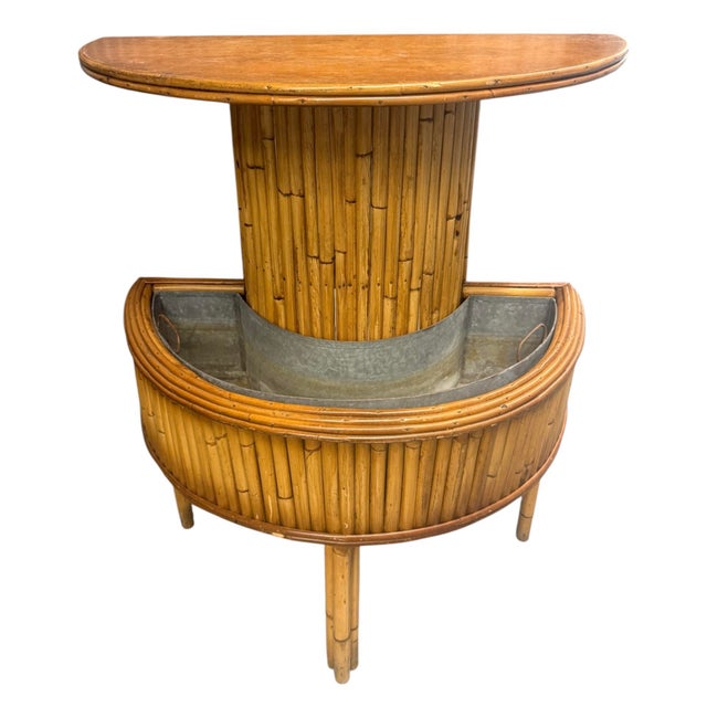 Rattan mid century planter with flat tabletop area. Semicircular design. Bottom level has a semicircular section for...