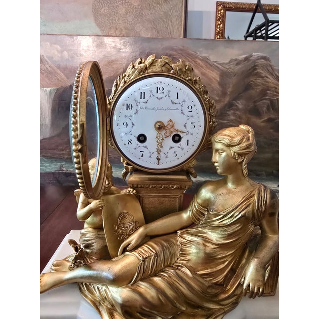 A magnificent museum quality french Louis xv bronze clock . Having gilded 24k ormolu gilt bronze on marble with...