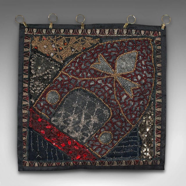 This is a small vintage decorative wall panel. A Middle Eastern, ornate square textile frieze with sequins and faux...