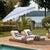 Transform your outdoor space with the sophisticated allure of the Lucerna 9 ft crank umbrella in a delightful baby blue...