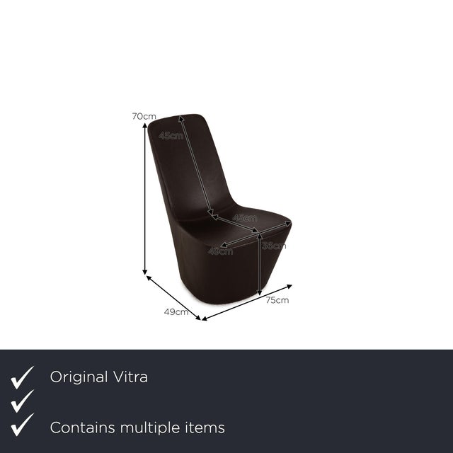 The Monopod armchair set by Vitra is upholstered in dark brown genuine leather and extends to the floor. Its minimalist,...