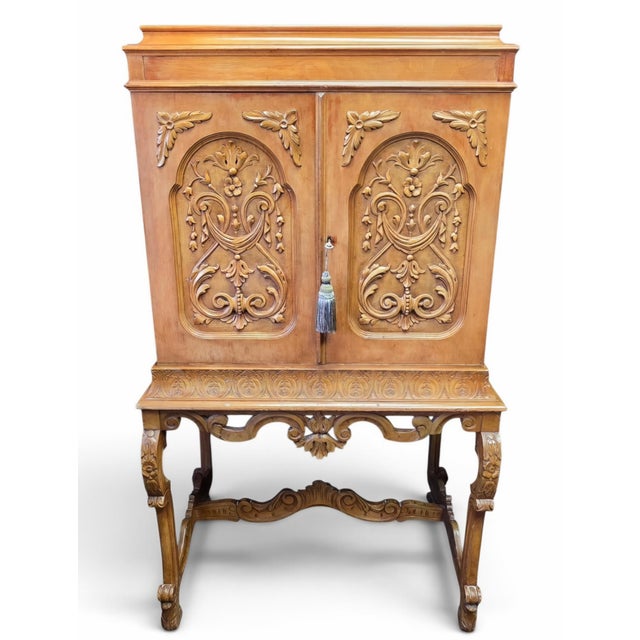 A striking Italian Rococo Revival cabinet-on-stand, dating to the mid-20th century, distinguished by an exceptionally...