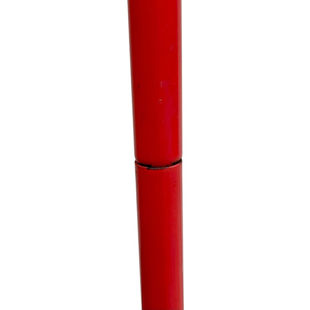 Bold and sculptural vintage freestanding tubular metal coat rack in a lacquered red finish, inspired by the iconic Memphis...