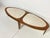 An American surfboard coffee table in walnut with Italian marble inserts, consisting of two identical wedge shaped...