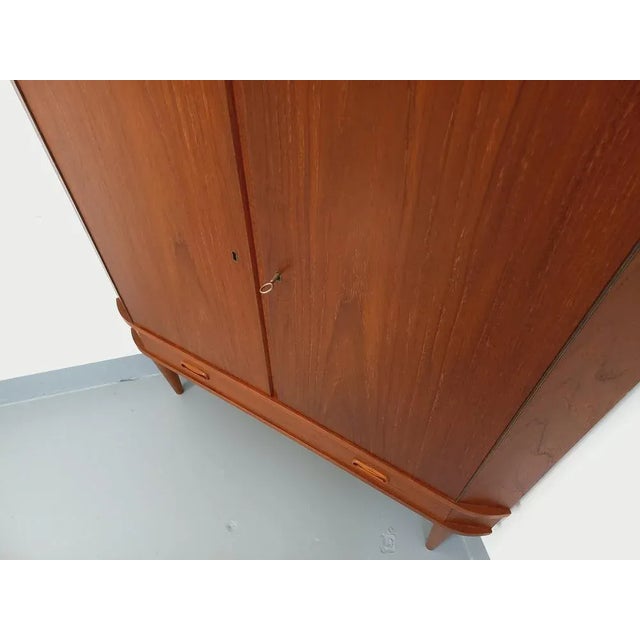 Scandinavian vintage storage unit from the 60s, Danish design, teak, compass feet, 2 doors with 2 interior shelves, 1...