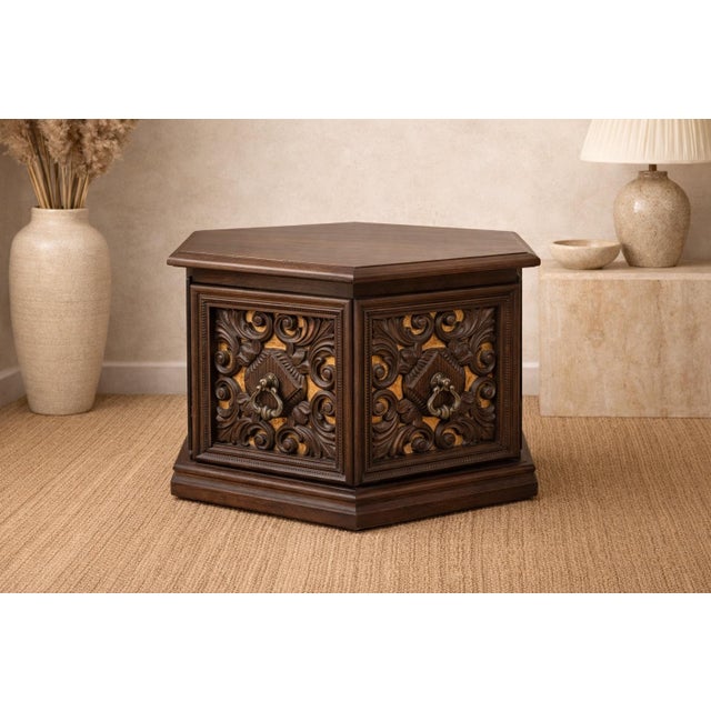 Striking vintage hexagonal wood cabinet with richly carved doors and original velvet panel inserts. Low and versatile in...