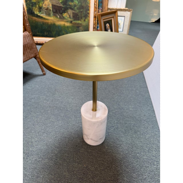 Design Plus Gallery presents the Narro Side Table from Article. The Narro table’s metal top dons an eye-catching brass...