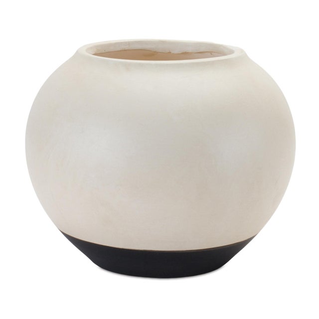 Elevate your home decor with the timeless beauty of this Two-Tone Ceramic Vase. Designed in a classic urn shape, this...