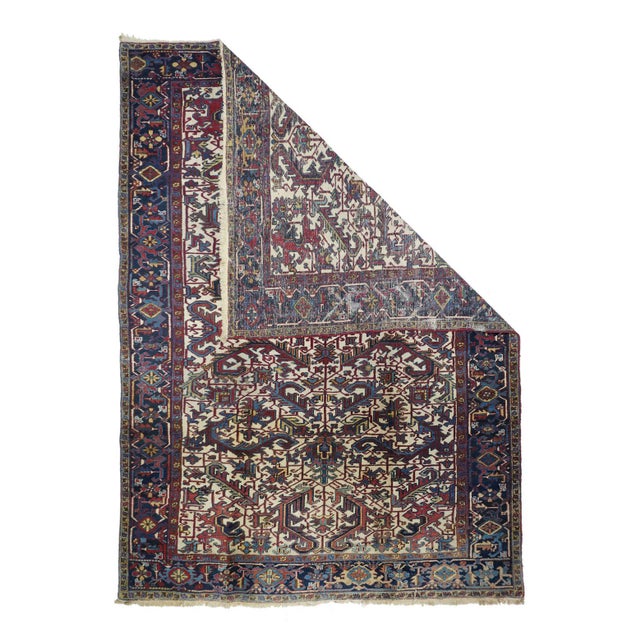 The ivory field is closely fitted with long ragged, geometric leaves positioned by a full-length central line and a small...