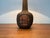 Great Danish studio Pottery table lamp from 1979. The lamp convinces with its elegant shape. The slim shaft that merges...