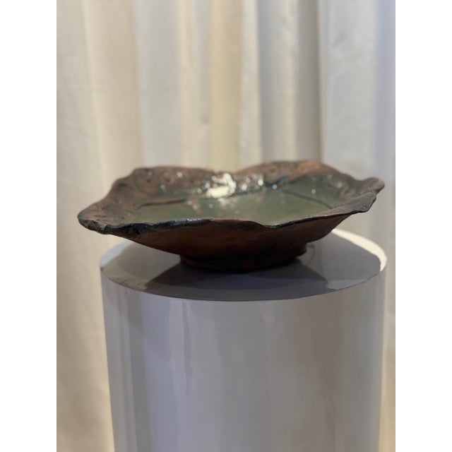 This stunning handcrafted ceramic art bowl is a true one-of-a-kind piece that blends rustic charm with modern artistry....