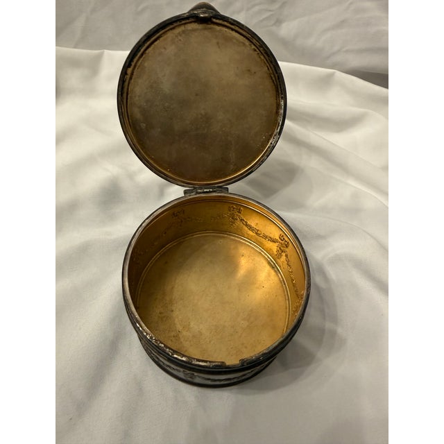 Offered here is an exquisite, authentic French First Empire Style dore bronze round vanity box from the late 19th century....