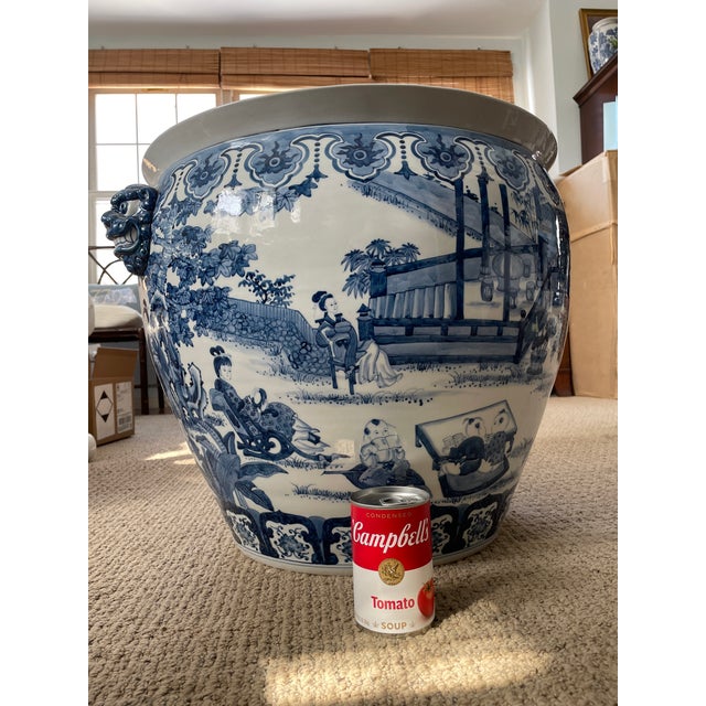 An exceptionally large and striking Chinese blue-and-white porcelain jardinière. The vessel features finely rendered hand-...