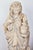 A beautifully sculpted terracotta statue depicting Winter. The robed figure is holding a burning cauldron of fire. A...