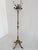 An exceptional Italian hall tree from the 1960s, crafted from richly ornamented brass and beautifully figured onyx marble....