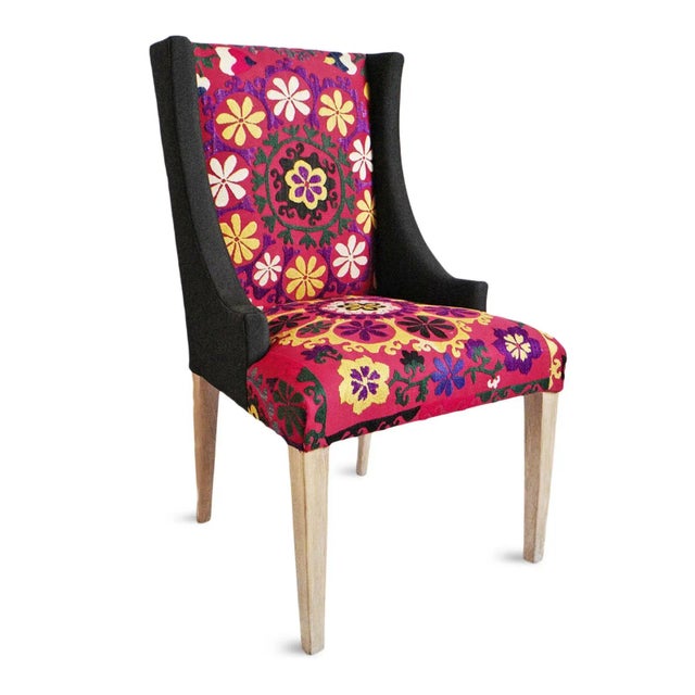 Striking colorful vintage hand embroidered Suzani fabric upholstered accent chair. Suzani fabrics were originally created...