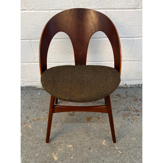 Beautiful set of four unique mid-century bentwood dining chairs, featuring sculptural curved forms and an organic design...