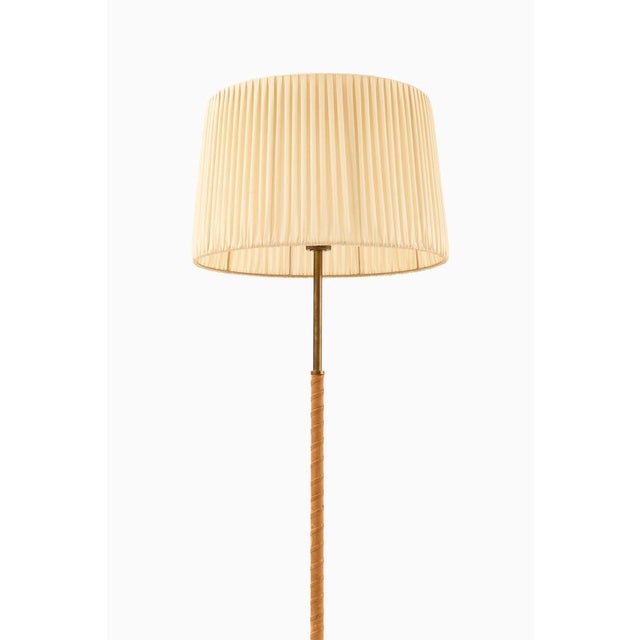 This rare floor lamp, designed by harald notini and produced by arvid böhlmarks lampfabrik in sweden during the 1940s,...