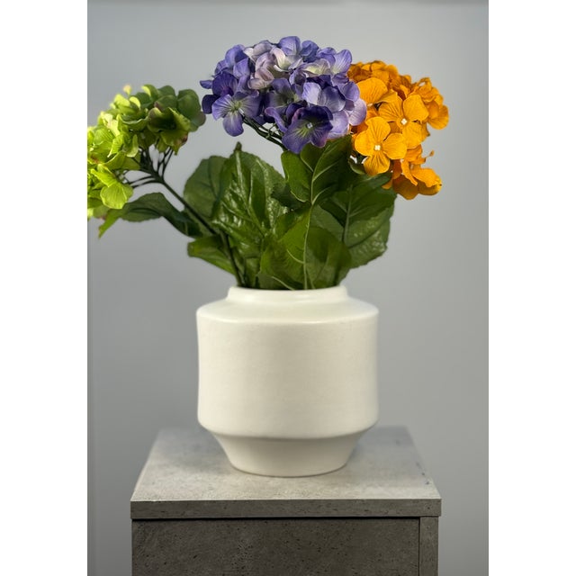 This white ceramic vase was designed by Jan Bontjes van Beek and manufactured in the 1960s by the Dr.-Ing. Alfred Ungewiss...