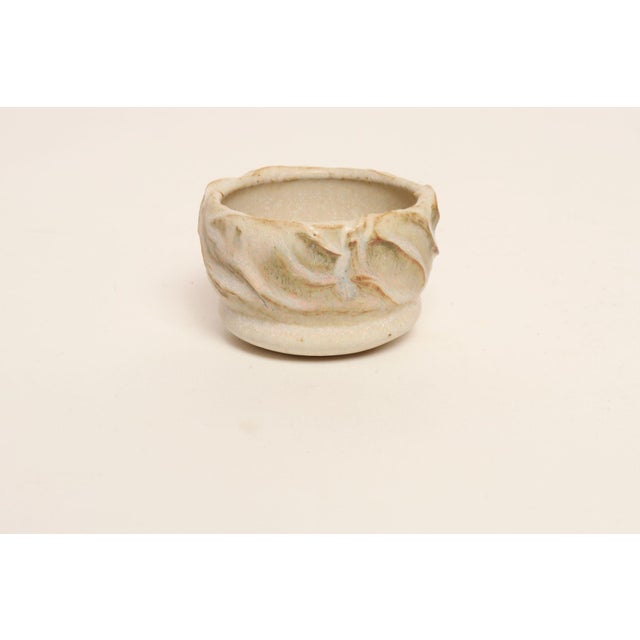 Variegated stoneware bud vase with drainage hole by ceramicist, Deanna Nichols (b. 1942-2017, Missouri). Holding a BFA...