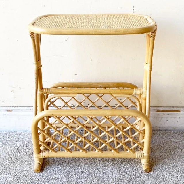 Exceptional vintage boho chair bamboo rattan magazine rack/side table. Features a wonderful sculpted design with a blonde...