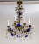 An Art Nouveau, 8-light chandelier with vibrant, deep blue molded crystal flowers and clear crystals in varying shapes....