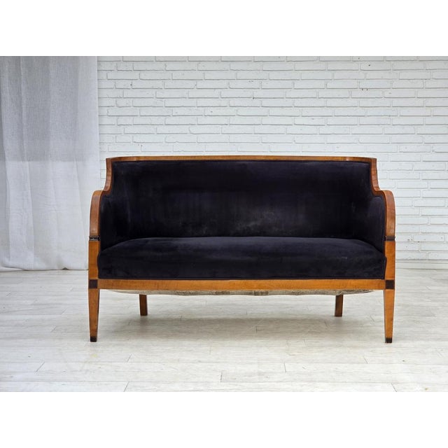1950s, Danish art deco 2-seater sofa. Laqered ash wood, dark blue furniture velour, brass springs in the seat. Sofa was...