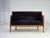 1950s, Danish art deco 2-seater sofa. Laqered ash wood, dark blue furniture velour, brass springs in the seat. Sofa was...