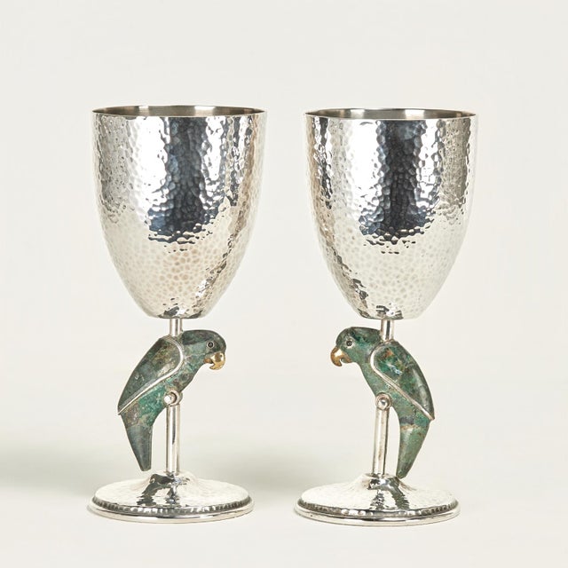 Mid century set of eight goblets handcrafted in silver plate on hammered copper featuring stone clad parrots or birds...
