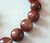 The length of the necklace is 17.5 inches (44.5 cm). The smooth, round beads are 17-18 mm in size. Bead knotting is...