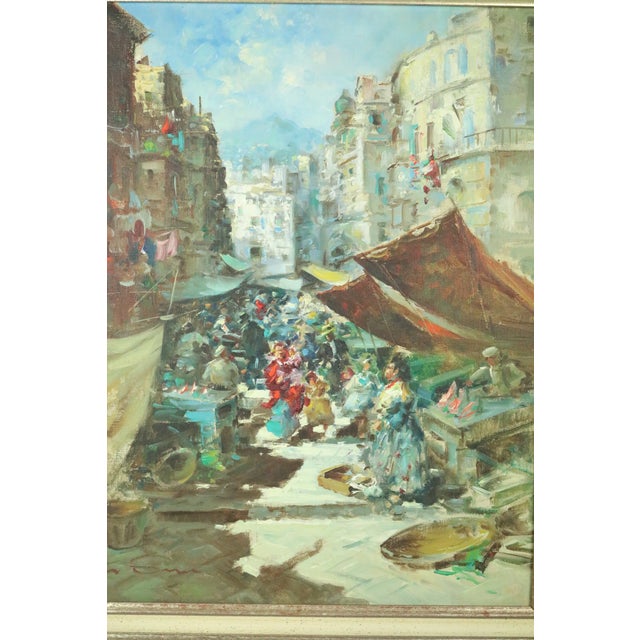 A framed oil on canvas painting by Walter Sicca. Sicca was an Italian painter known for his animated city scenes with...