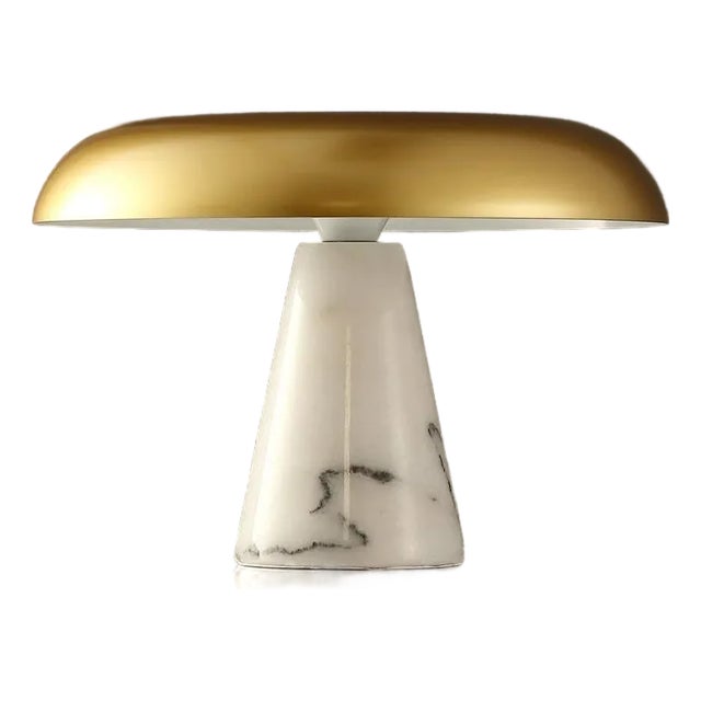 Introducing the Vaughan table lamp, a stunning blend of brass and white marble that elevates any space with its...