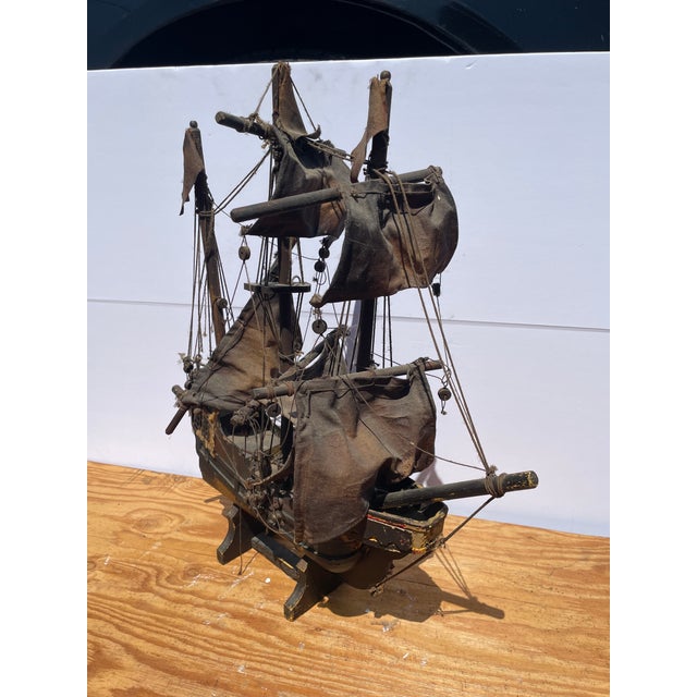 here we have a very old hand made model ship (custom). This ship has seen better days BUT it has that look many of us look...
