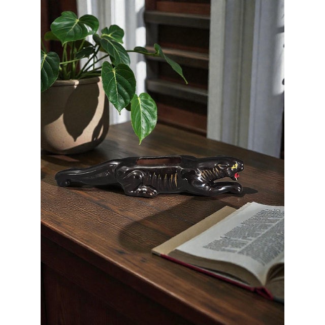 This vintage 50s glazed terra-cotta pottery black panther small succulent planter is a unique and decorative piece that...
