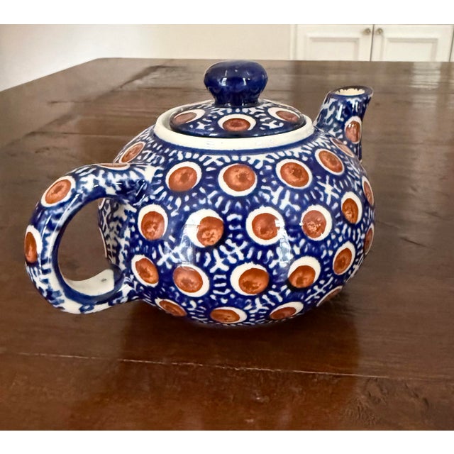 This Boleslawiec pottery teapot is hand-crafted stoneware from Poland. It is hand painted in a traditional pattern of...